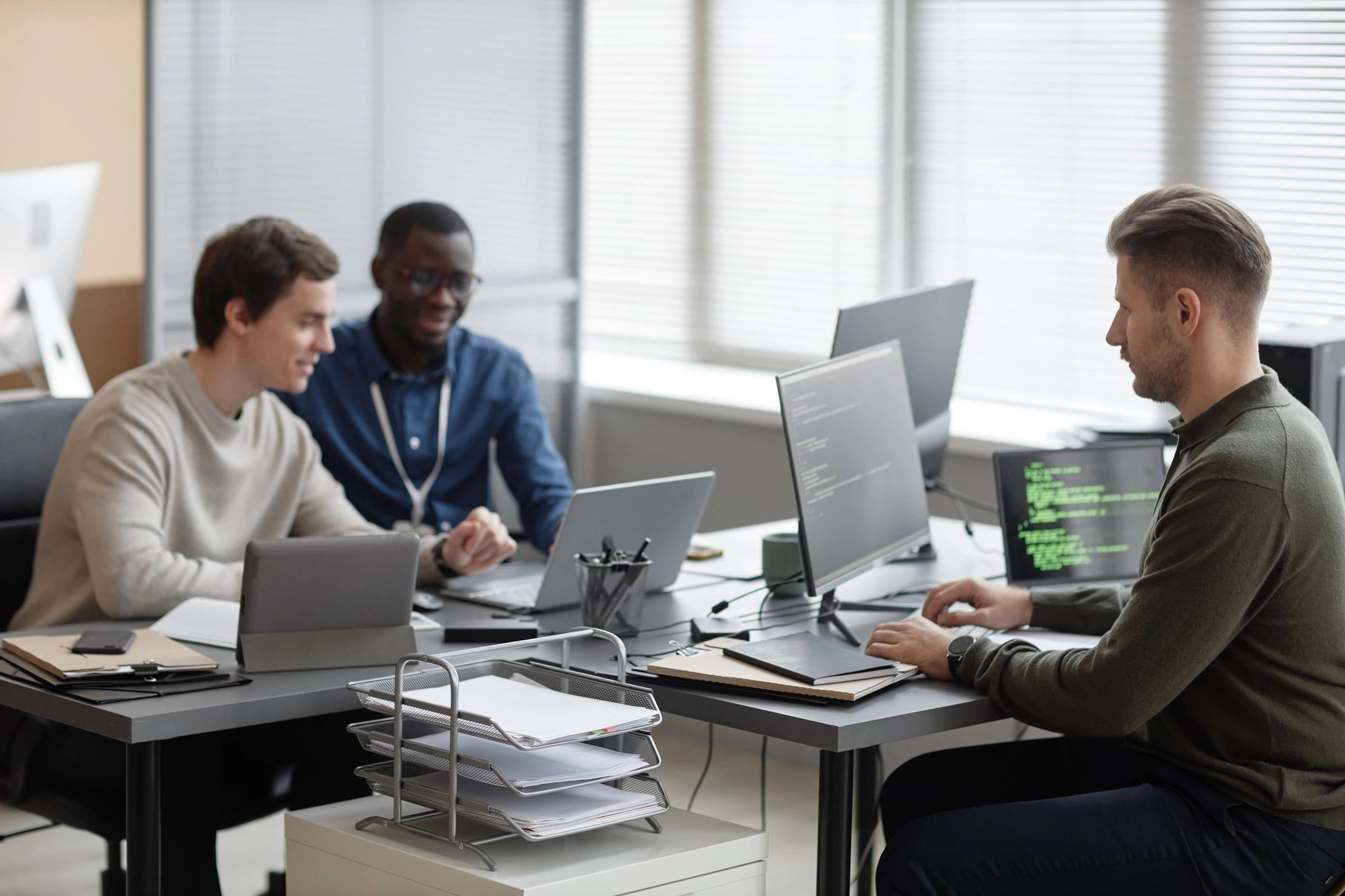 Technology team working together in a modern office